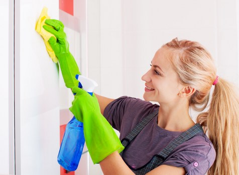 Cleaner using protective equipment during tenancy cleaning