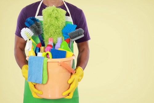 Professional office cleaners working in a London workplace reception area