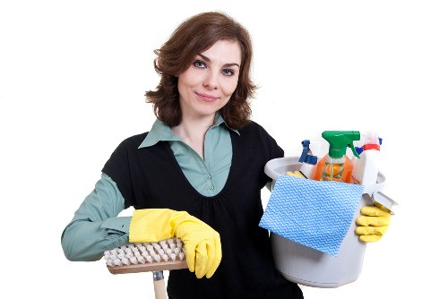 Technician cleaning an armchair in a London property
